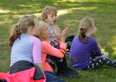 8 Kids Sitting In Park